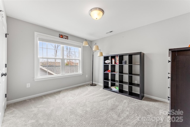 unfurnished room featuring light carpet, baseboards, and visible vents