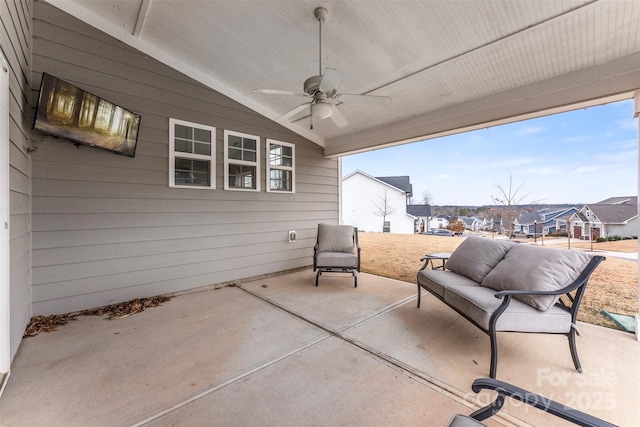 view of patio / terrace with a residential view, ceiling fan, and an outdoor living space