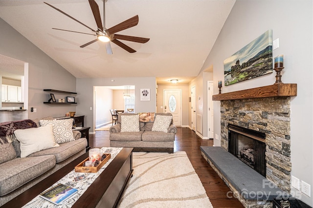 living room with a fireplace, high vaulted ceiling, dark hardwood / wood-style floors, and ceiling fan