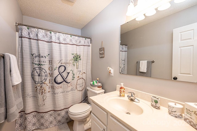 bathroom featuring vanity, toilet, a textured ceiling, and walk in shower