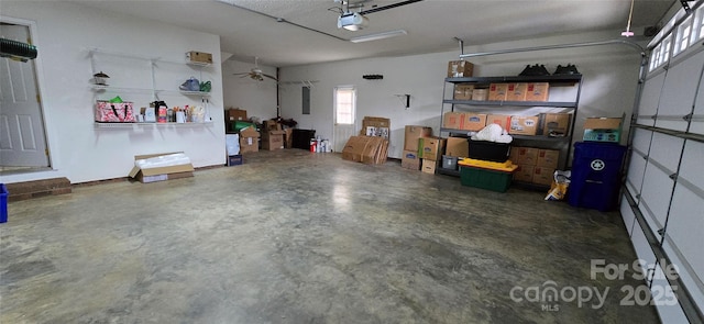 garage featuring a garage door opener and electric panel