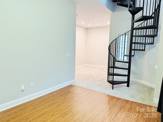 stairs with hardwood / wood-style floors