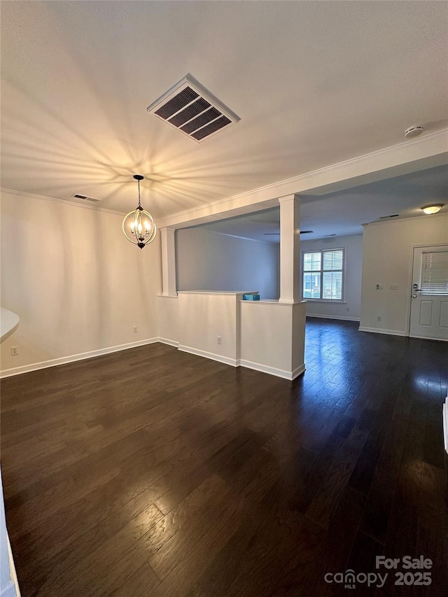 unfurnished room featuring dark wood-type flooring and a chandelier