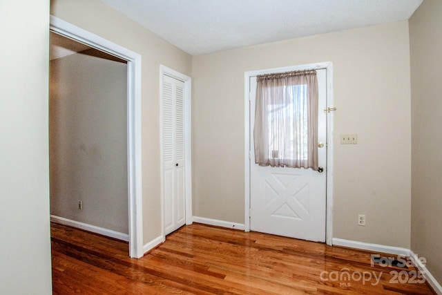 foyer with hardwood / wood-style flooring