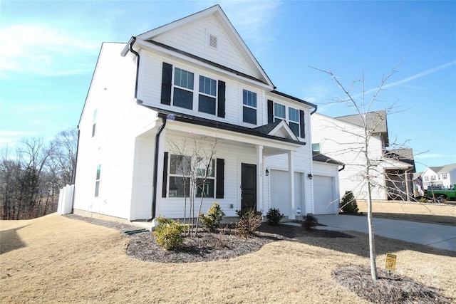 view of front property featuring a garage and a porch