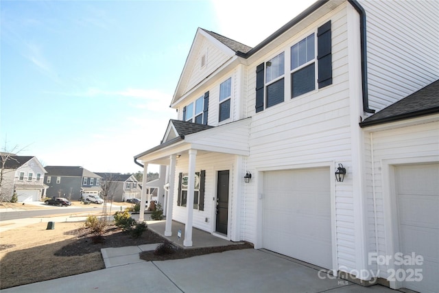 view of front of house with a garage and a porch