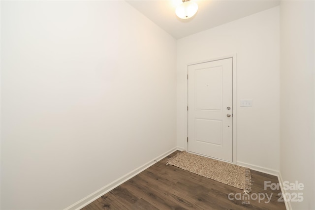 entryway with dark wood-type flooring