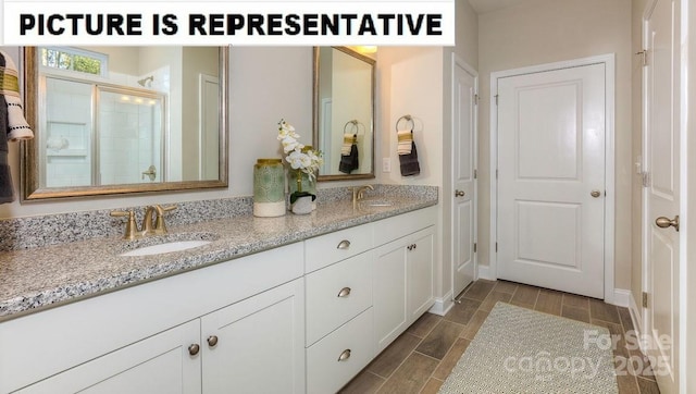 bathroom with vanity and walk in shower