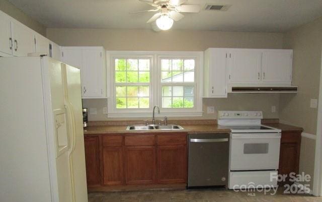 kitchen featuring sink, white appliances, exhaust hood, and white cabinets