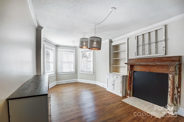 unfurnished living room featuring dark wood-style flooring, ornamental molding, a fireplace with flush hearth, a textured ceiling, and baseboards