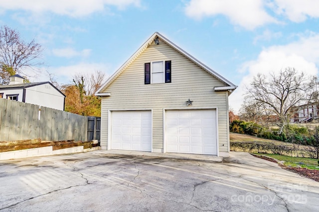 detached garage with fence