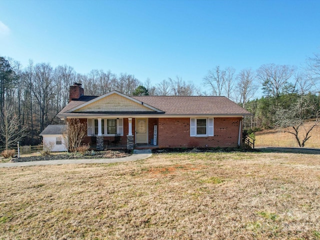 single story home featuring covered porch and a front lawn