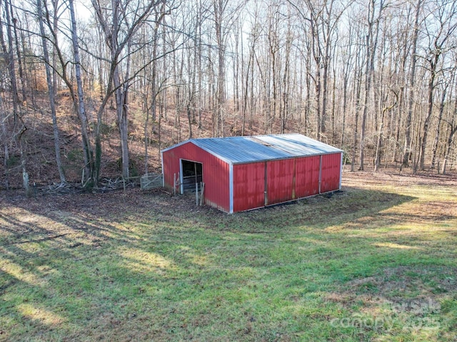 view of outbuilding with a lawn