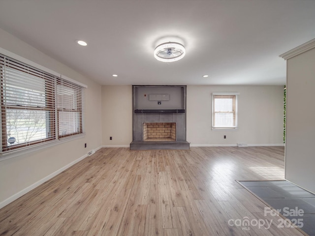 unfurnished living room featuring light hardwood / wood-style flooring