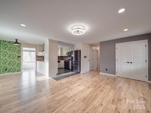 unfurnished living room featuring light hardwood / wood-style flooring