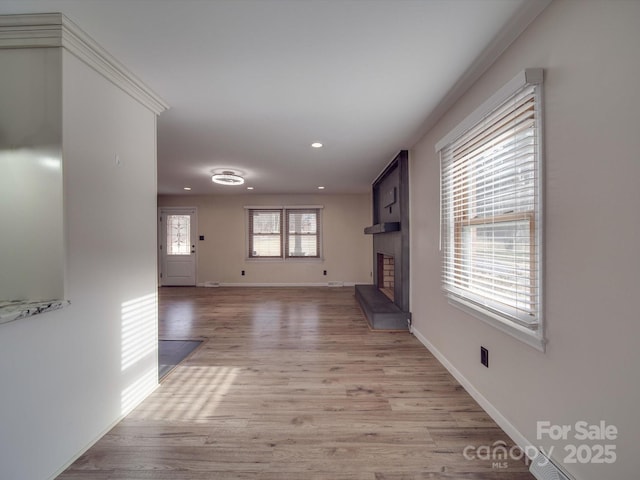 unfurnished living room with light hardwood / wood-style floors