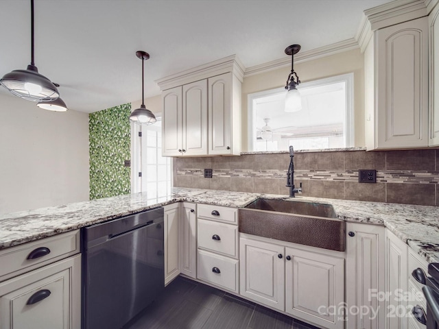 kitchen featuring black dishwasher, sink, and hanging light fixtures