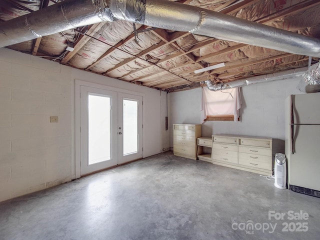 basement with white refrigerator