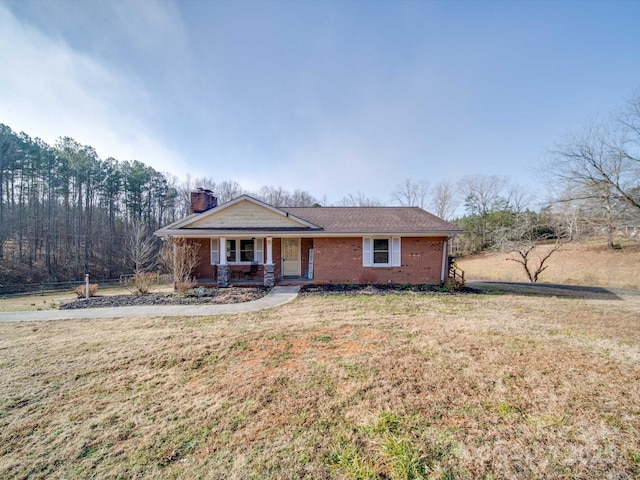 ranch-style house with a front lawn and a porch