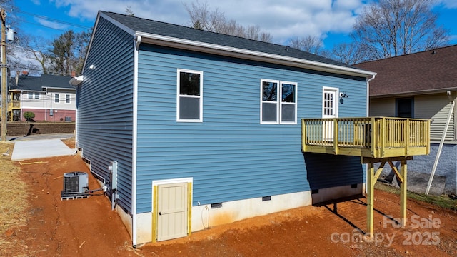 view of home's exterior featuring central AC and a deck