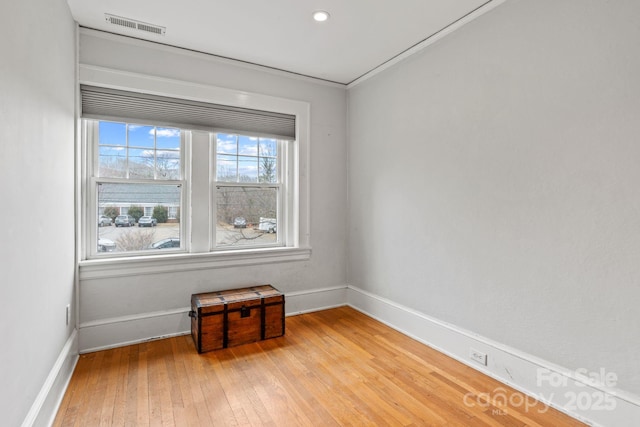 spare room with light hardwood / wood-style floors