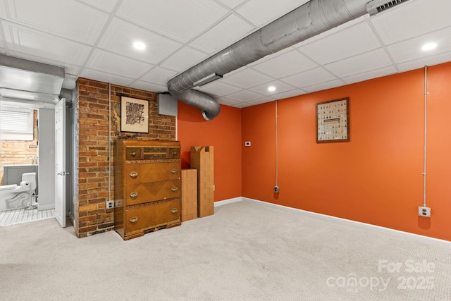 basement featuring light carpet