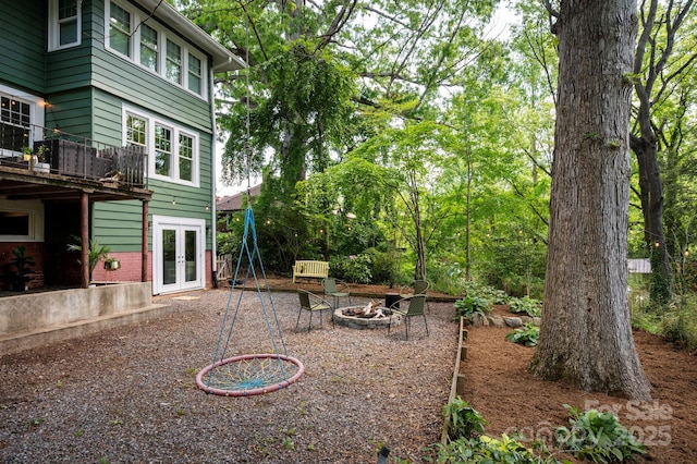 5 Chiles Ave, Asheville, NC 28803 - view of yard with french doors and an outdoor fire pit