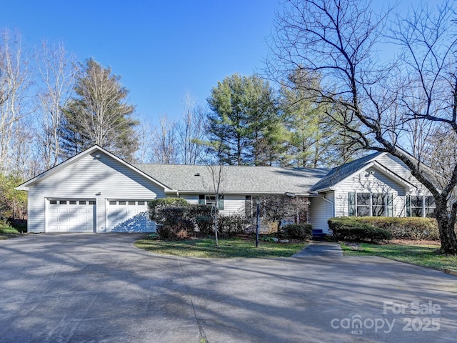 single story home featuring a garage