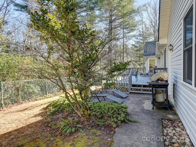 view of yard with a wooden deck