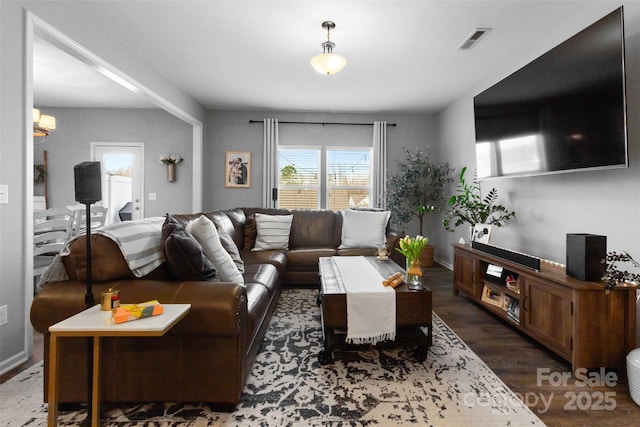 living room with dark hardwood / wood-style flooring