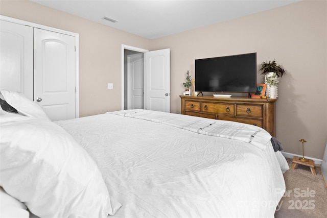 bedroom with carpet floors and a closet