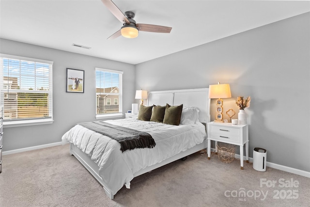 bedroom featuring ceiling fan and light carpet