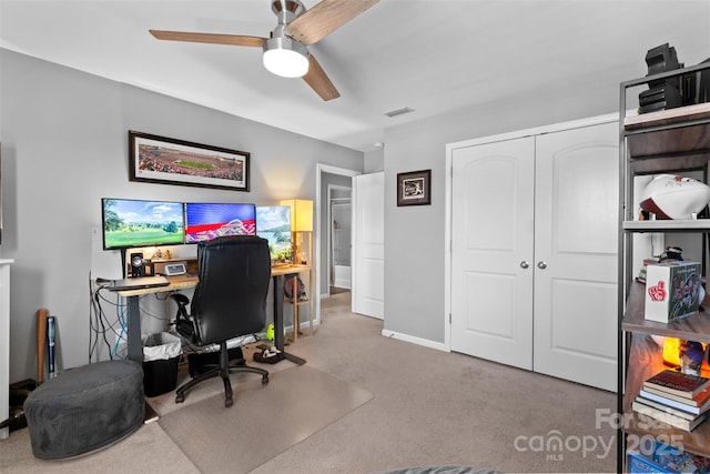 carpeted office with ceiling fan