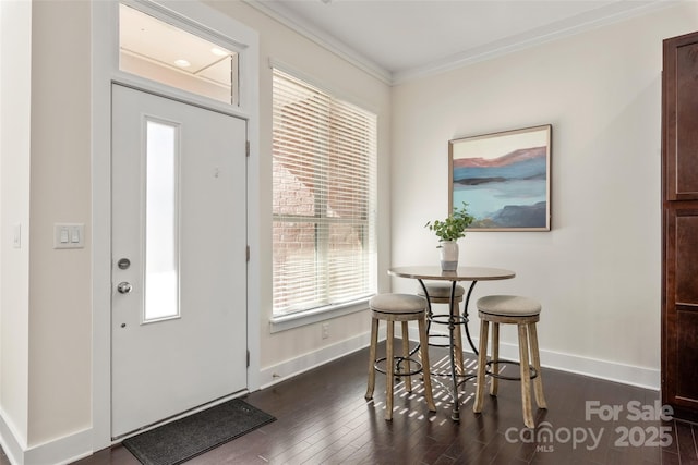 entrance foyer featuring dark hardwood / wood-style flooring and crown molding