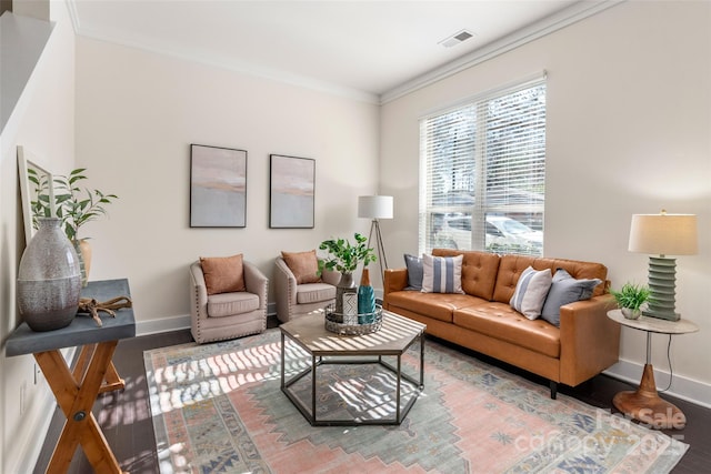 living room with hardwood / wood-style floors and ornamental molding