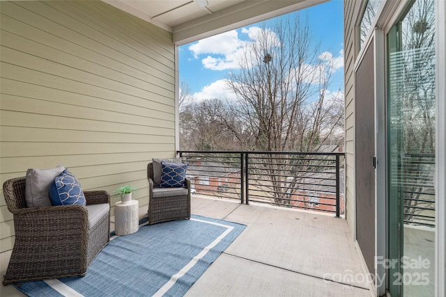 view of patio / terrace with a balcony