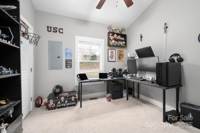 home office featuring ceiling fan, lofted ceiling, electric panel, and light carpet