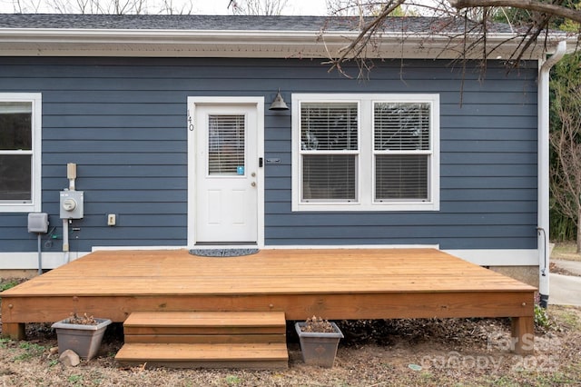 doorway to property with a deck