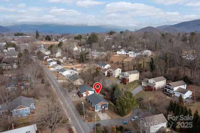 drone / aerial view featuring a mountain view