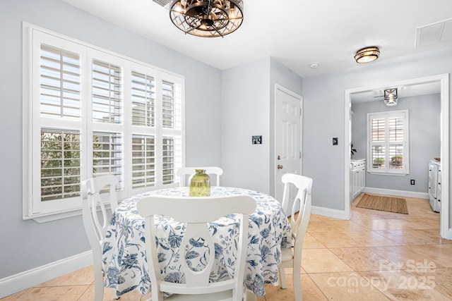 dining area with light tile patterned floors