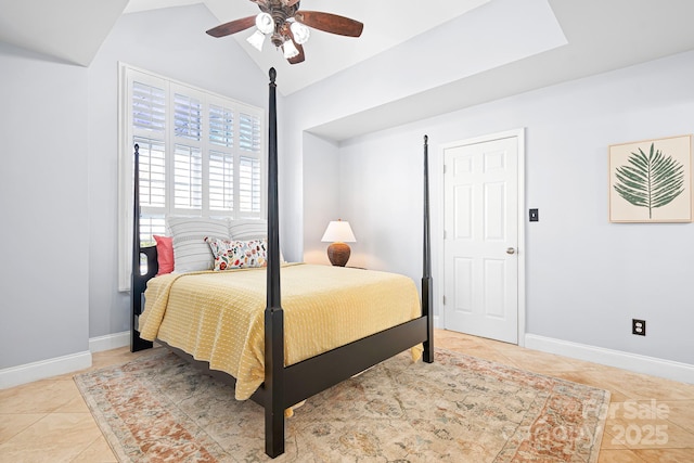 tiled bedroom with vaulted ceiling and ceiling fan