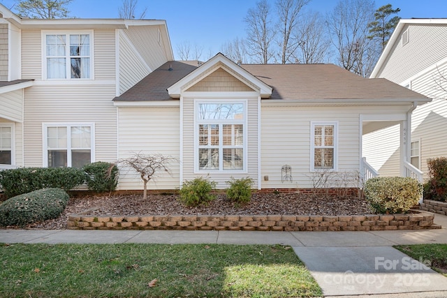 view of home's exterior with a lawn