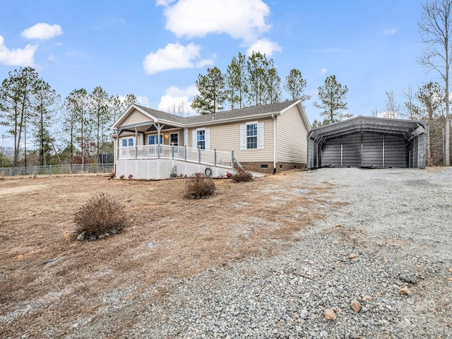 view of front of house featuring a carport and covered porch