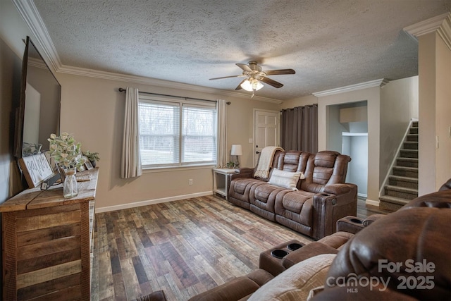 living room featuring ornamental molding, dark hardwood / wood-style floors, a textured ceiling, and ceiling fan