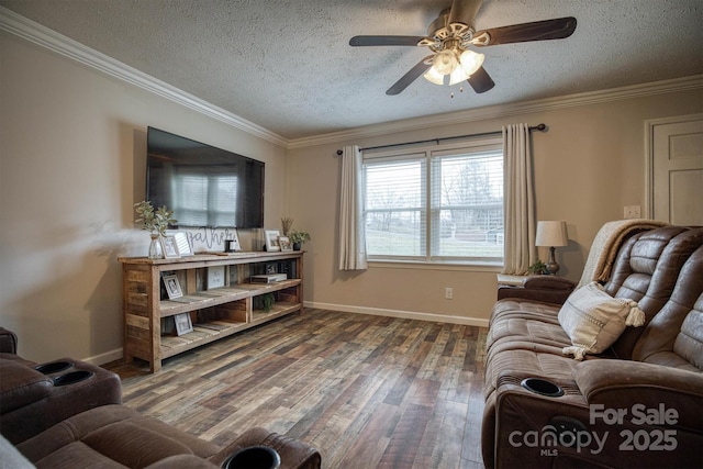 living room featuring ceiling fan, ornamental molding, dark hardwood / wood-style flooring, and a textured ceiling