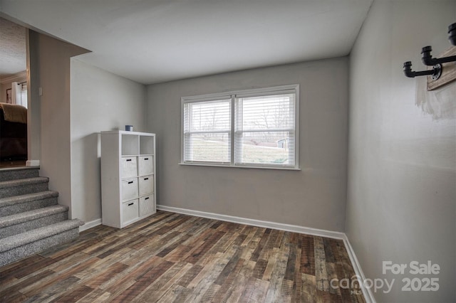 spare room with dark hardwood / wood-style flooring