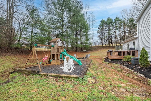 view of playground with a wooden deck