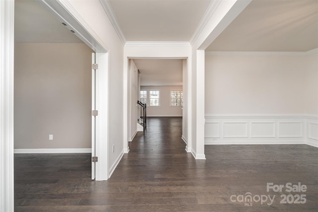 hall featuring crown molding and dark hardwood / wood-style floors