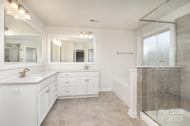 bathroom with vanity, tile patterned floors, and shower with separate bathtub