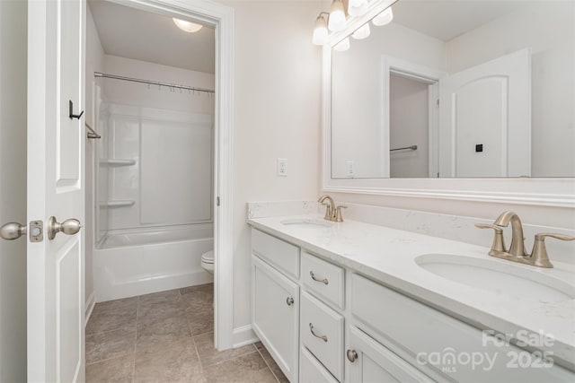 full bathroom featuring shower / bathing tub combination, vanity, and toilet